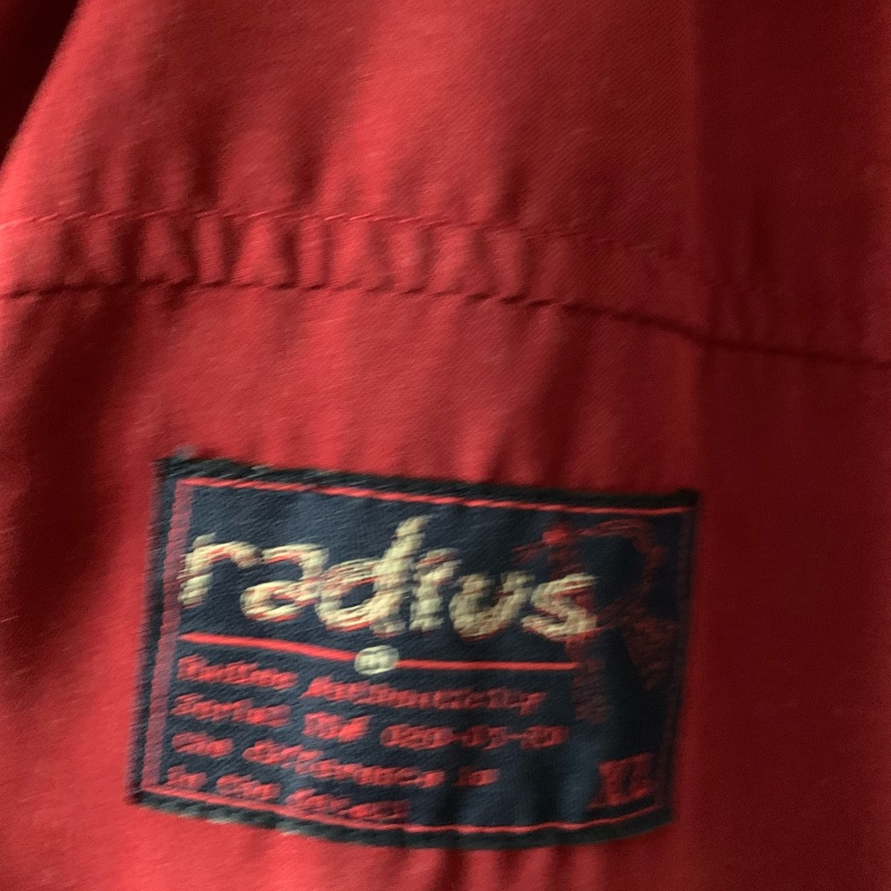 Men’s vest jacket made by Radius.  Red with gray interior. Size xl. NWT